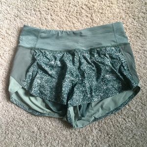 Green Outdoor Voices Hudson running shorts.